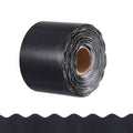 Black rolled scalloped bulletin board border trim on a spool, with white backing lines