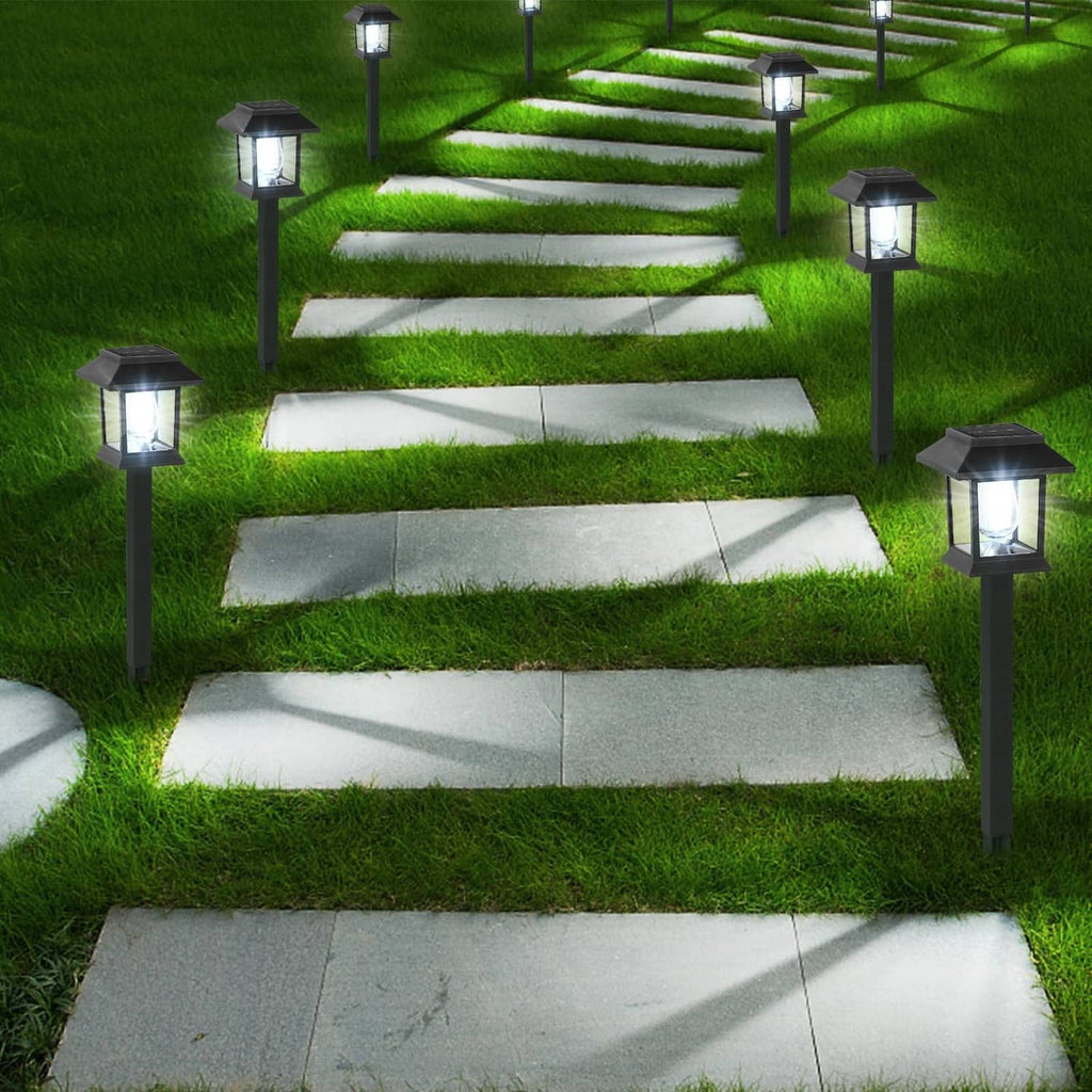 Black solar pathway lantern lights lining garden steps with spike bases