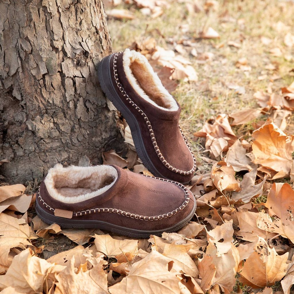Brown fuzzy moccasin slippers with plush lining and chain-stitched trim, slip-on style