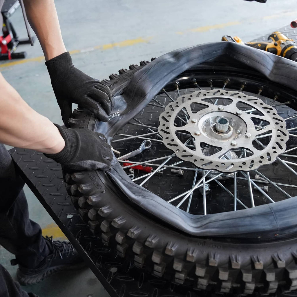 Dirt bike wheel with installed black inner tube inside tire