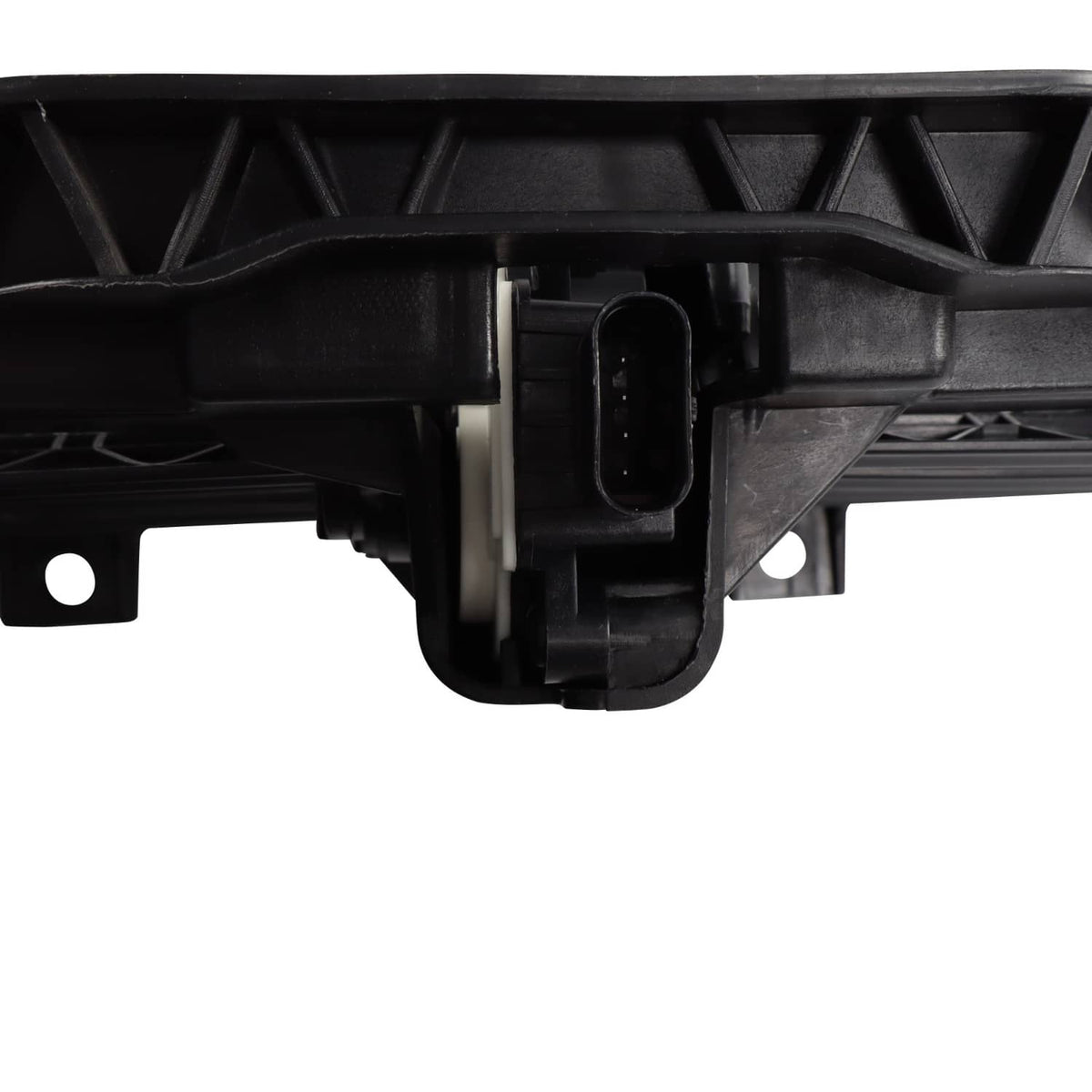 Close-up: black electrical connector area on upper radiator grille air shutter