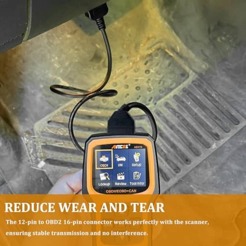 OBD1 to OBD2 12-pin to 16-pin adapter connected to a handheld diagnostic scanner