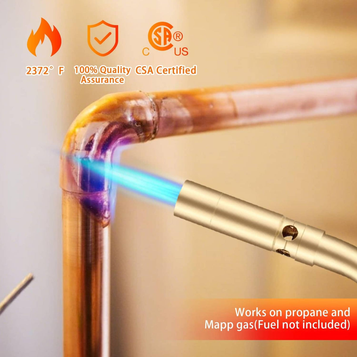 Solid brass propane torch head heating a copper pipe with blue flame
