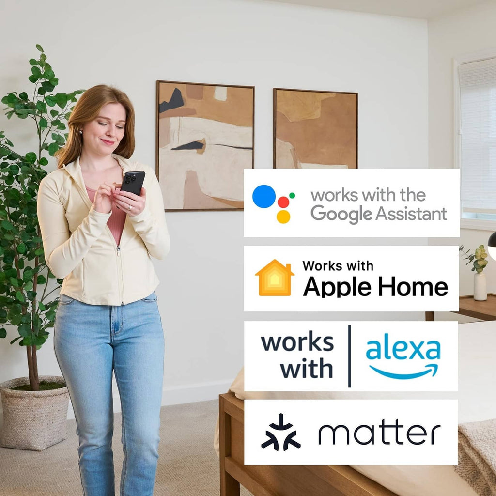 Person holding a smartphone to control a smart thermostat with assistant compatibility icons