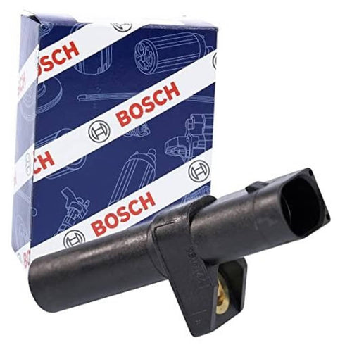 Crankshaft position sensor with black housing and mounting tab, shown with box