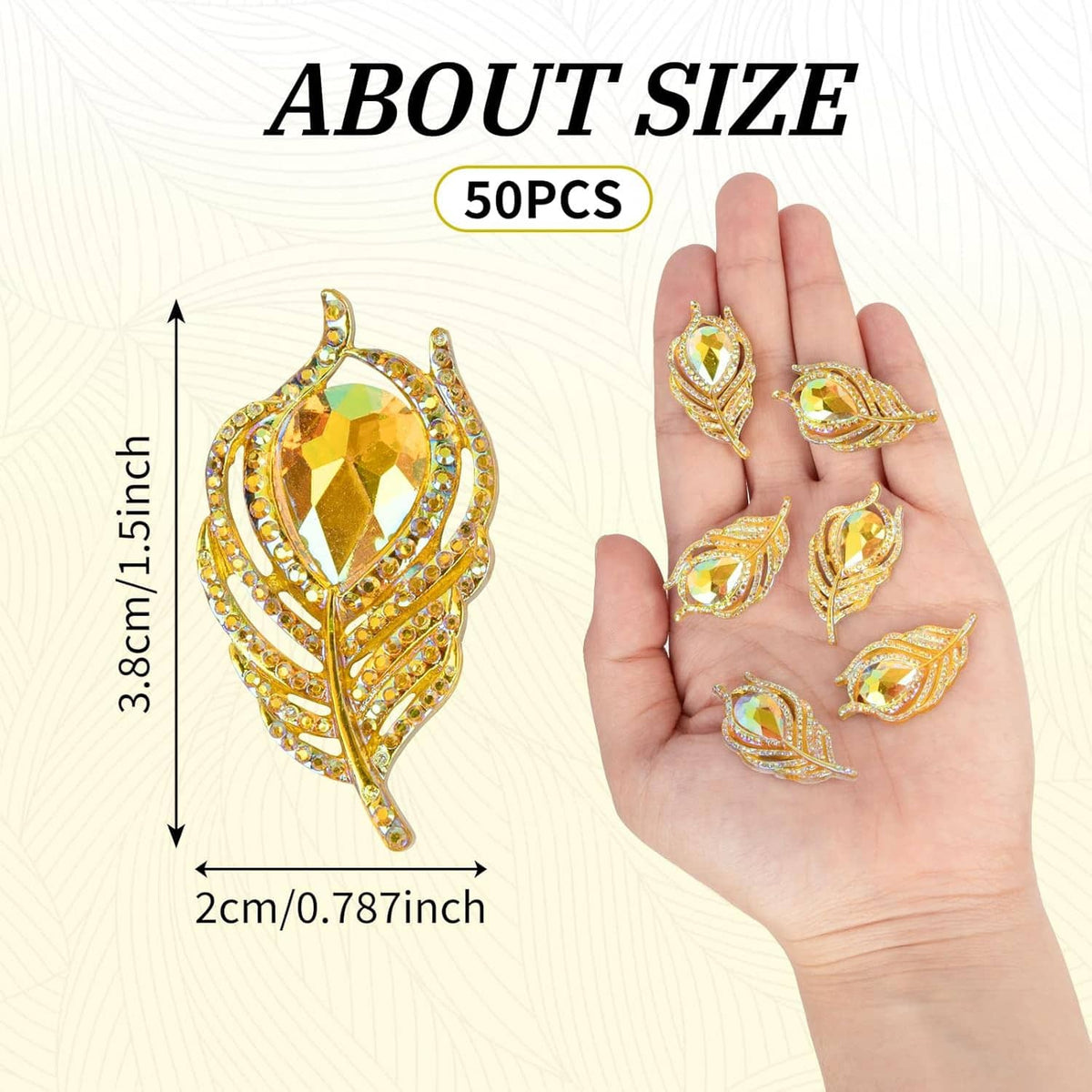 Gold rhinestone feather flatback pieces held in a hand for craft decorating