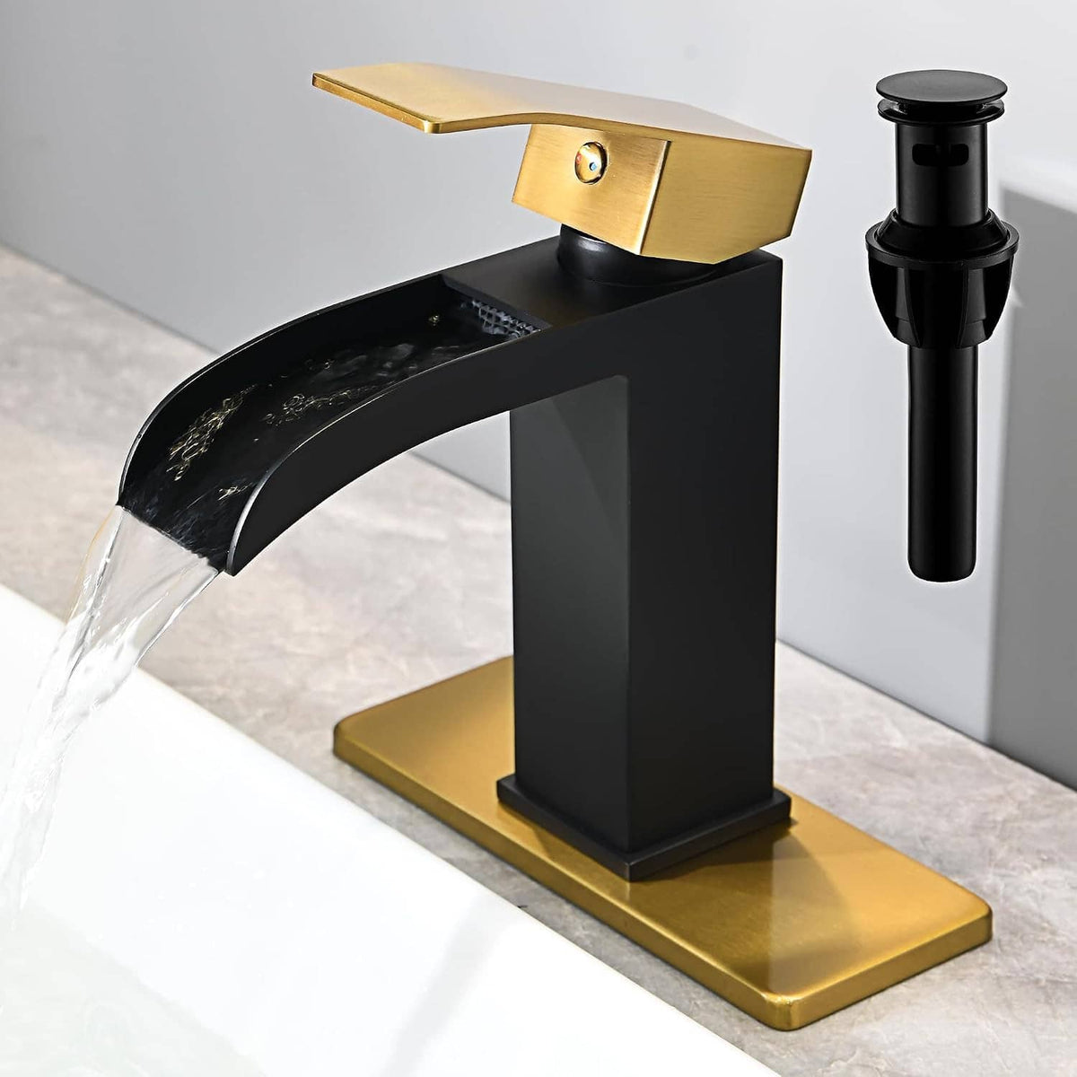 Black and gold waterfall bathroom faucet with arched spout and deck base