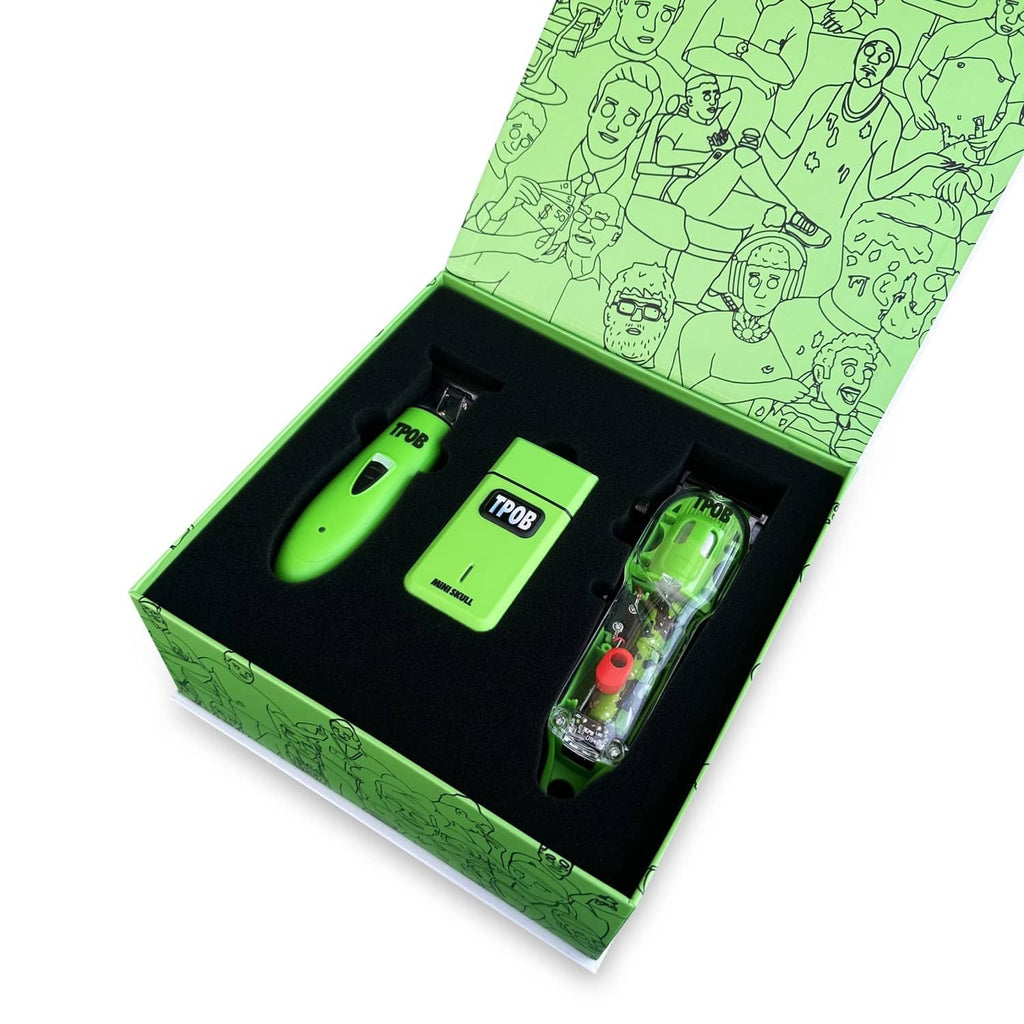 Hair clipper set in open box with green tools and transparent detailing piece