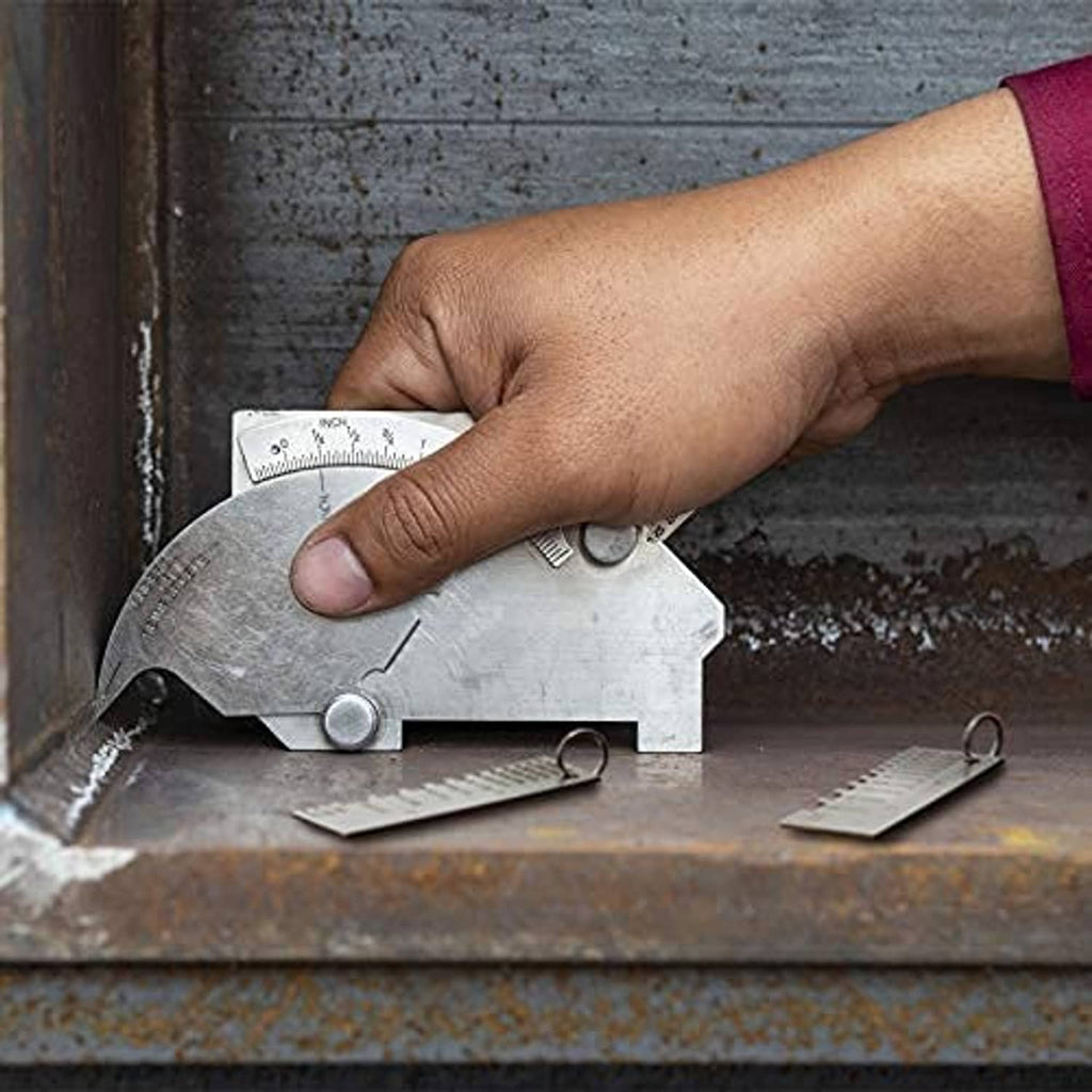 Metal sheet thickness gauge being held against a steel surface for measurement