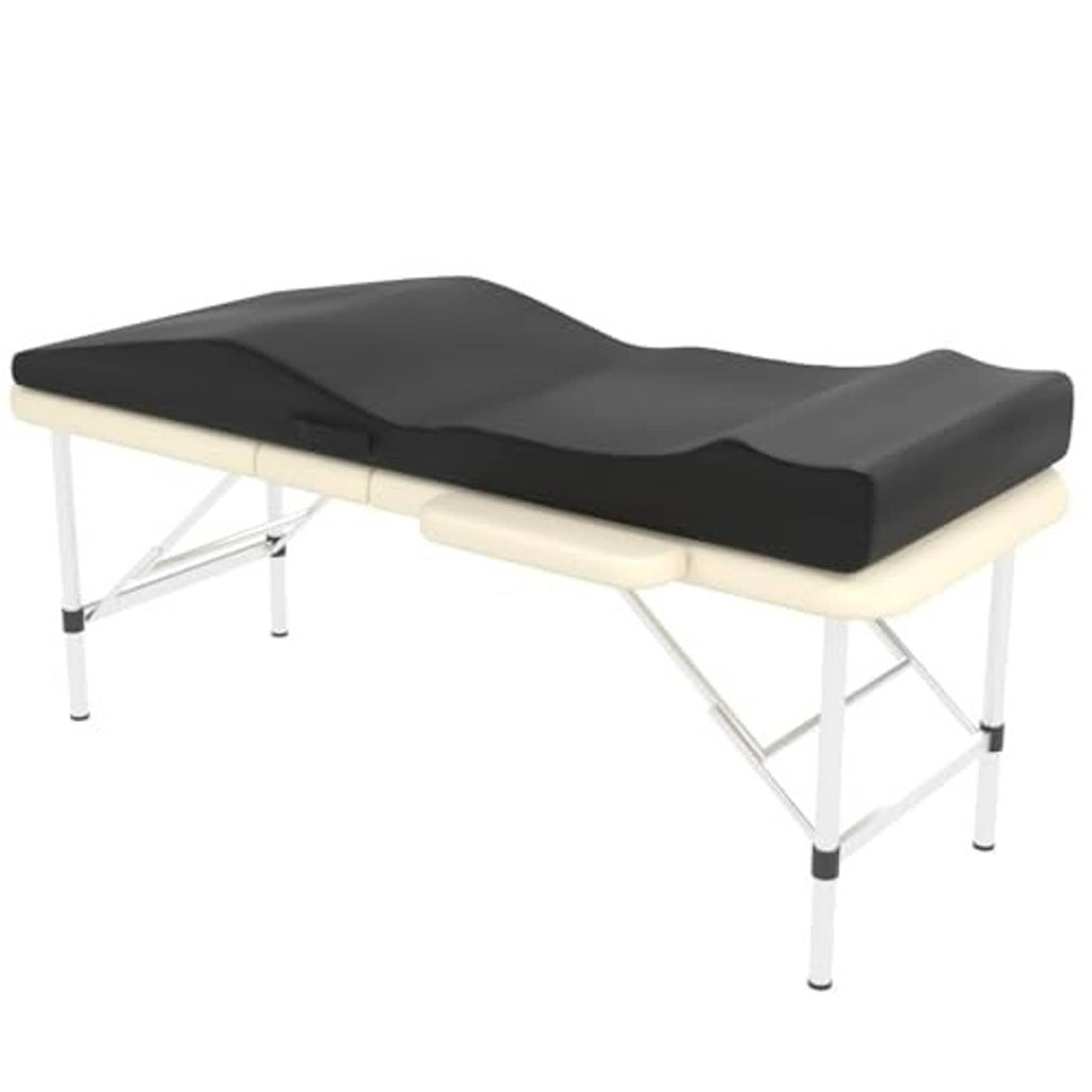 Black contoured massage table foam topper on a light-colored folding bed frame