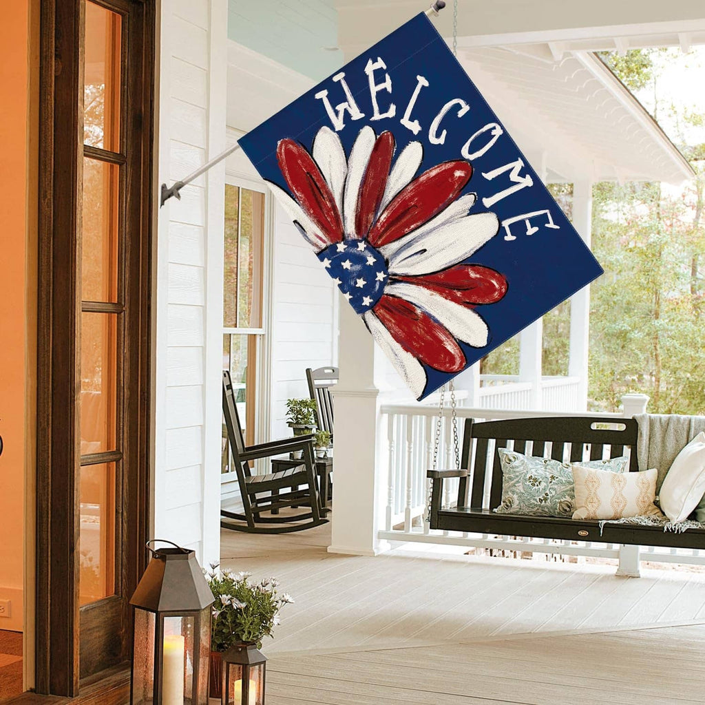 Patriotic house flag angled view with red-white-blue flower and "WELCOME" letters