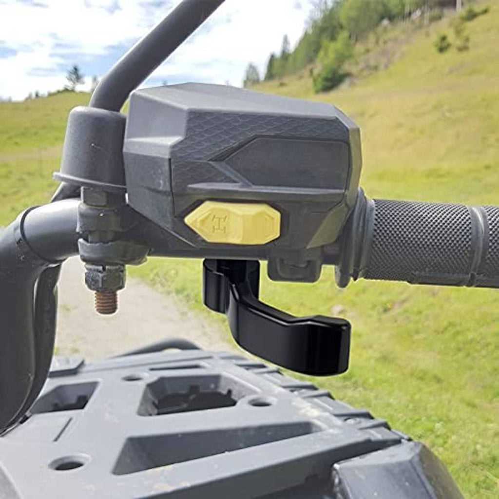 Black thumb throttle lever installed on ATV handlebar beside yellow switch panel