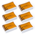 Six-pack rosin blocks in white holders, orange-gold rosin for string bows