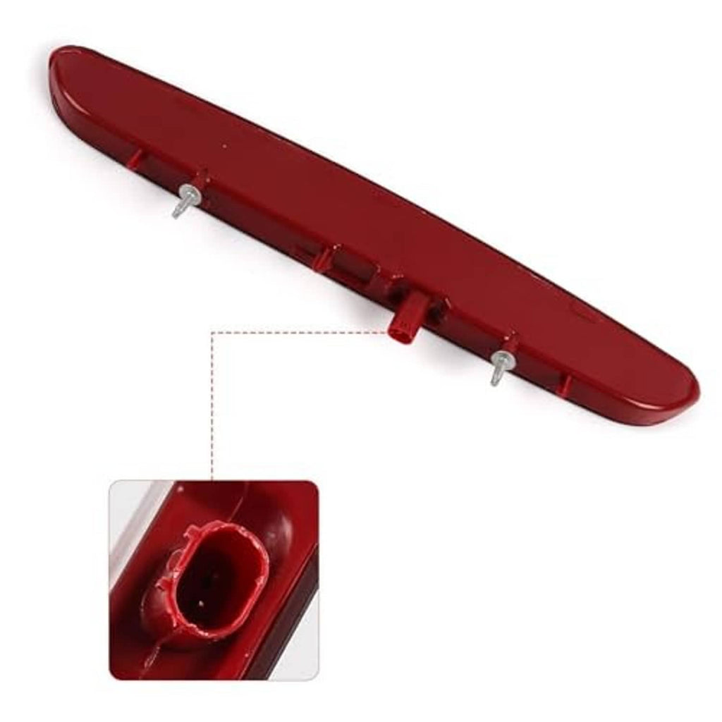 Red third brake light housing with mounting clips and circular connector opening
