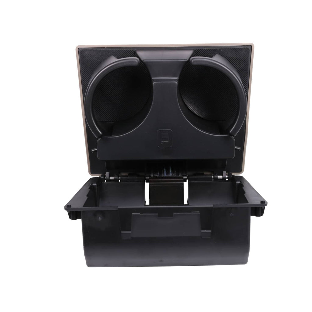 Black dashboard cup holder face with two cup openings and textured center panel