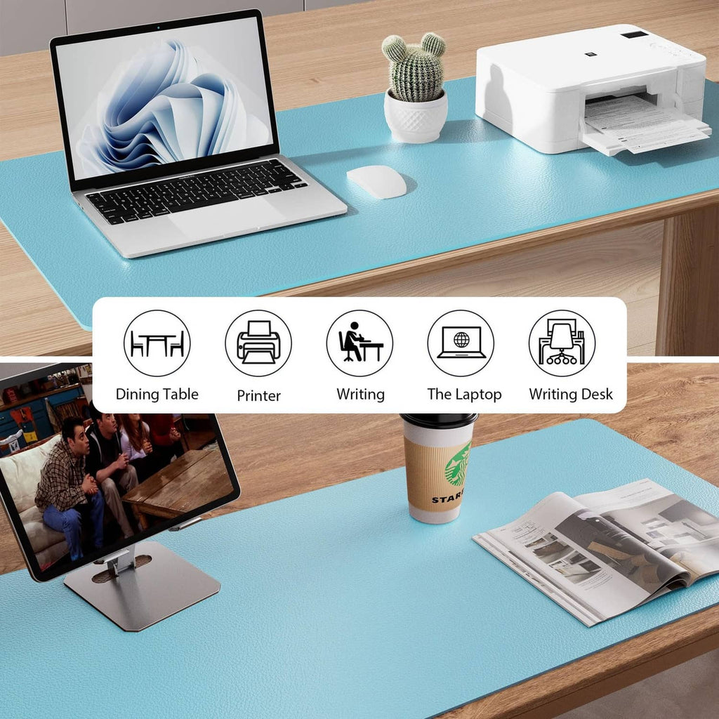 Blue topaz desk pad protector for laptop and accessories on a desk