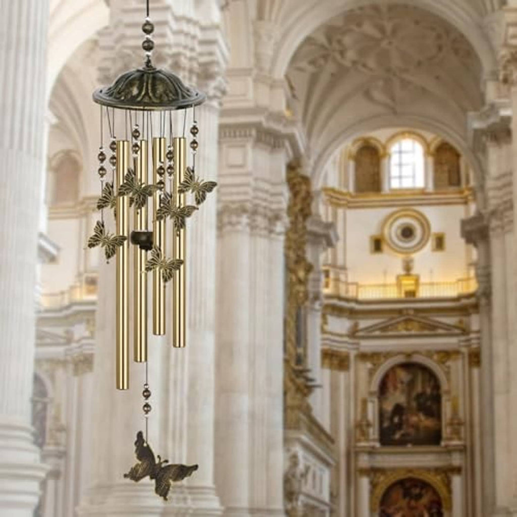 Bronze butterfly wind chime with domed top, gold rods, and butterfly hanging charm