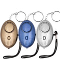 Personal security alarm fob, three pack with brown, blue, and gray keychains