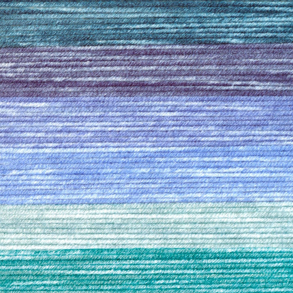 Close-up of variegated yarn texture in light blue and teal