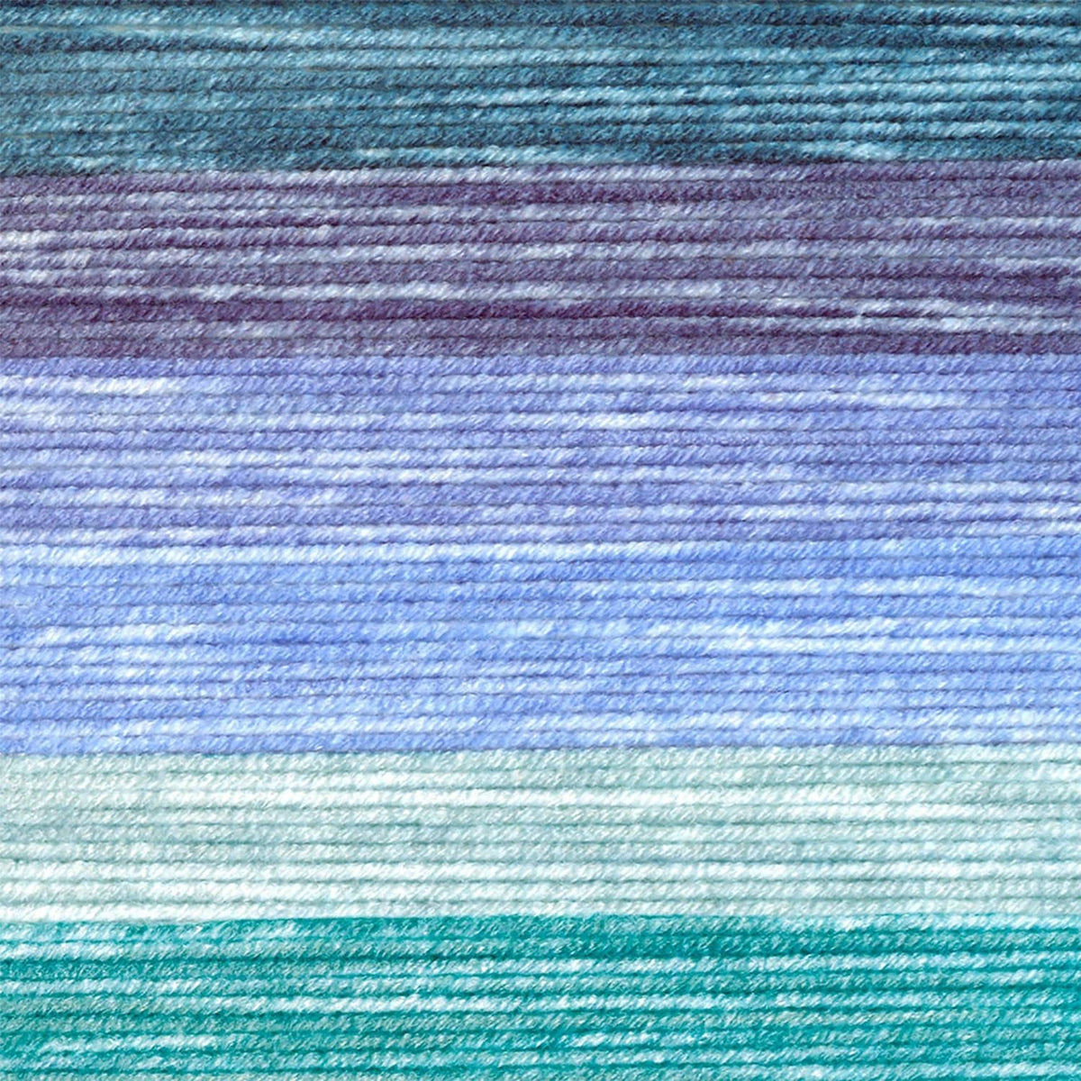 Close-up of variegated yarn texture in light blue and teal