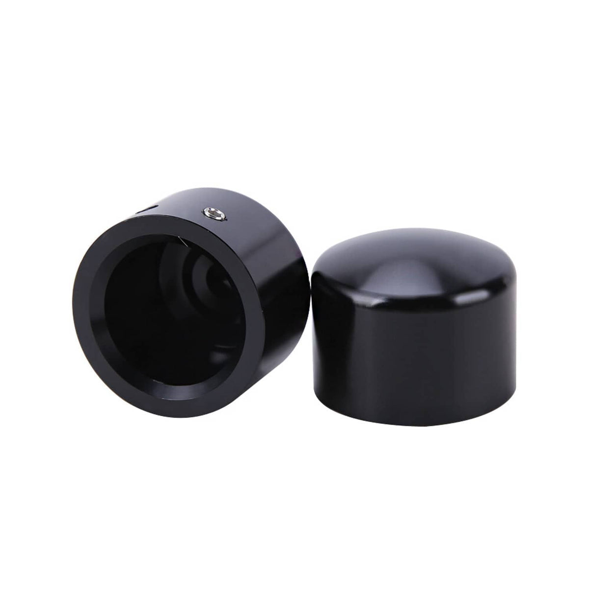 Black front axle cap nut covers, two domed caps shown from angled sides