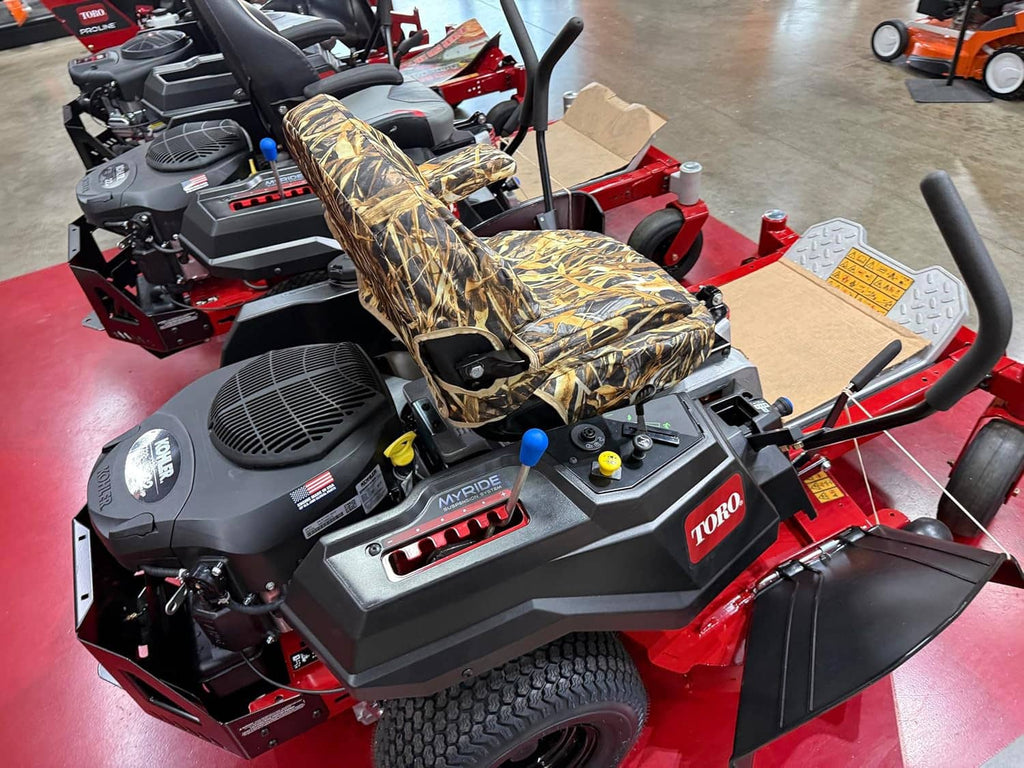 Camouflage seat and cover on Timecutter zero-turn mower with front controls visible