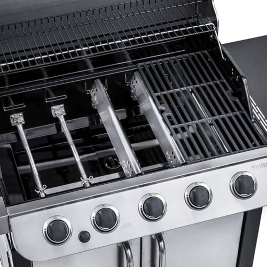 Gas grill burner area with stainless replacement burner tubes and cooking grates