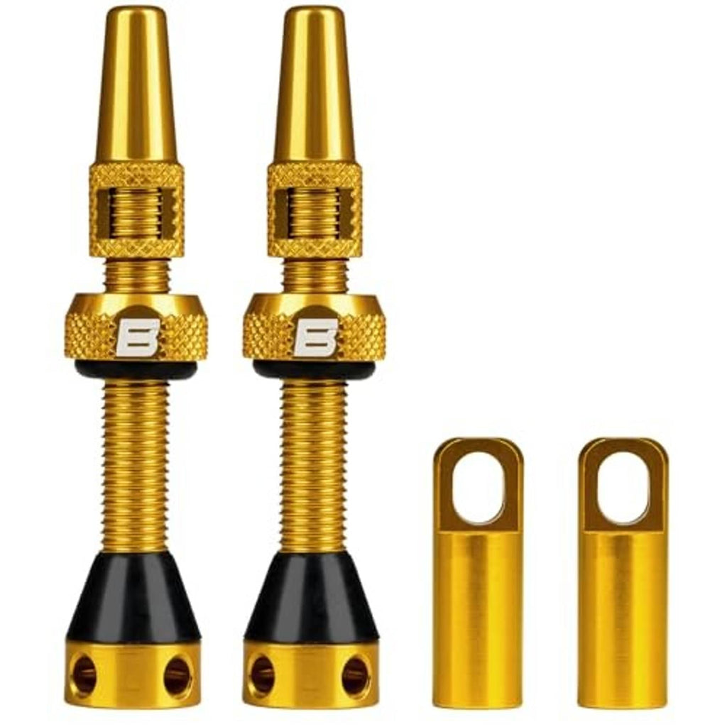 Golden tubeless Presta valve stem set with knurled collar, black base, protective caps