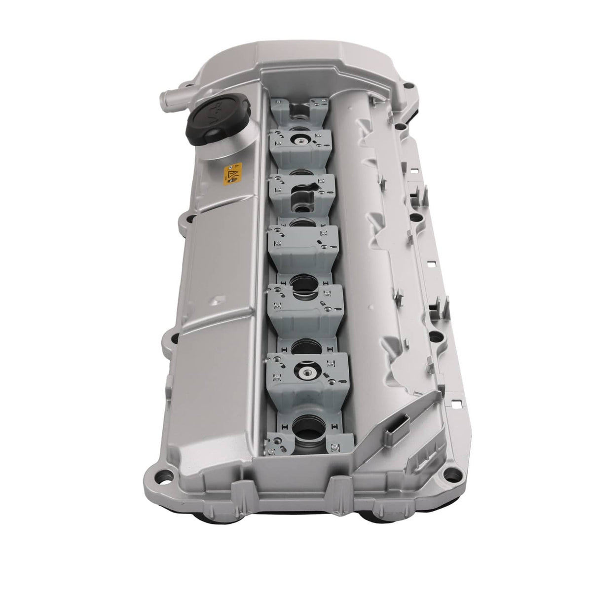 Light gray aluminum valve cover housing with internal openings and black oil cap