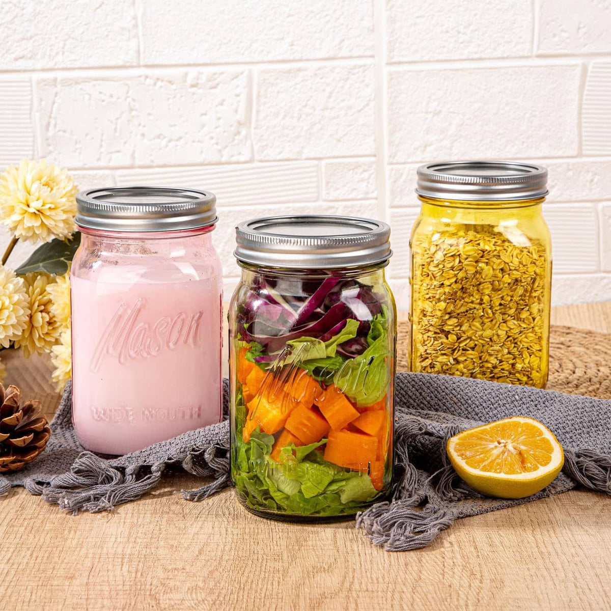 Assorted wide-mouth mason jars with metal lids: pink jar, mixed veggies, and a yellow jar.