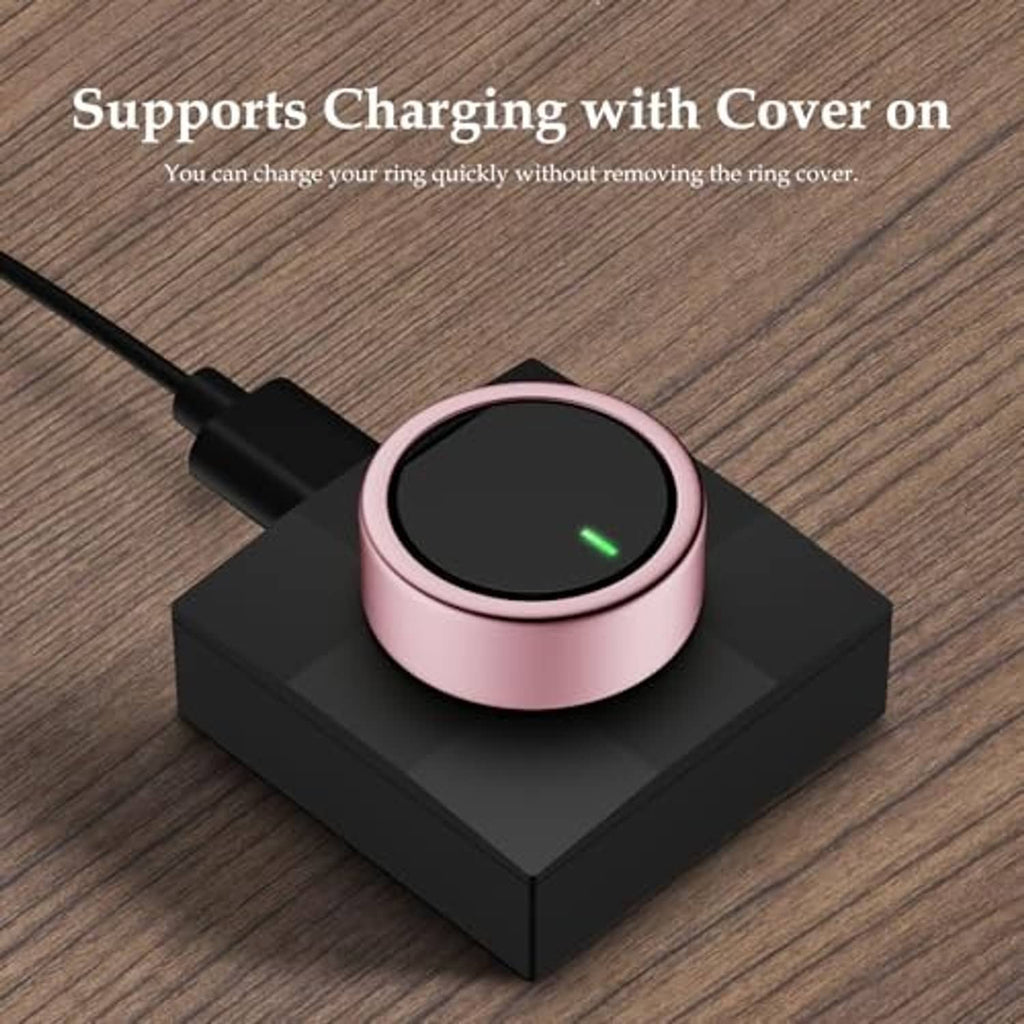Pink ring cover on black charging base with lit status light