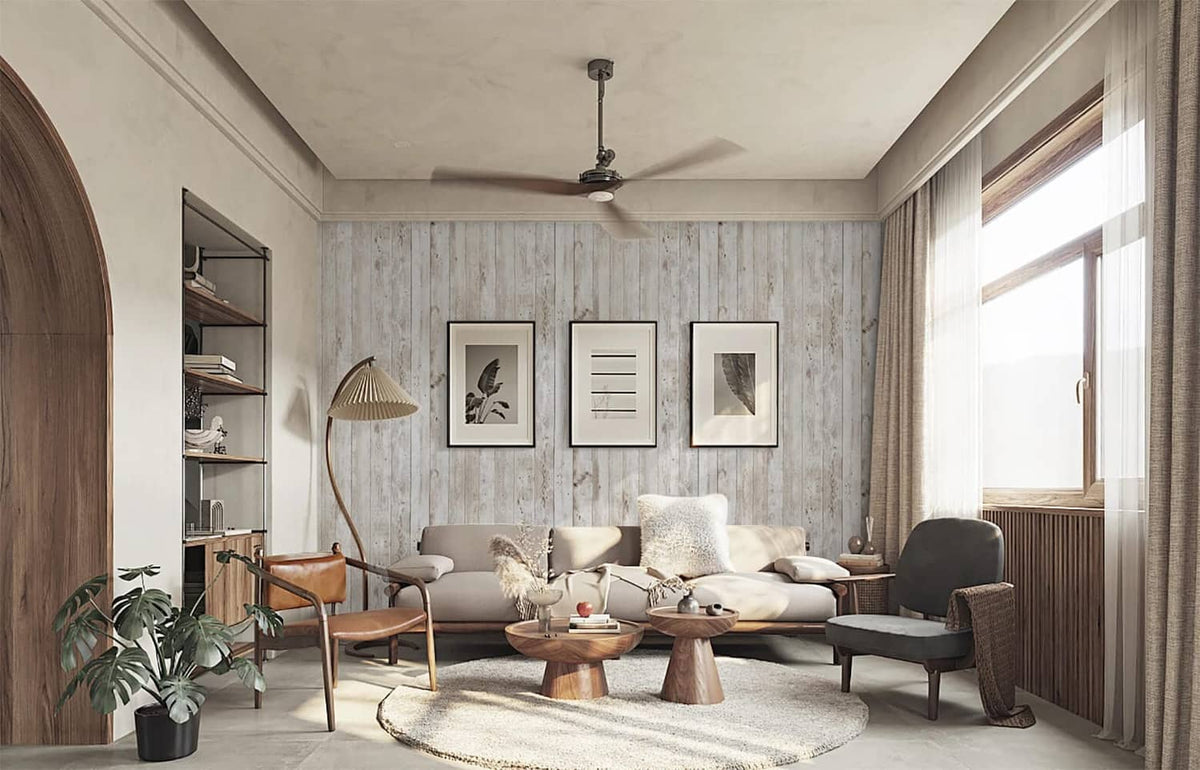 Wood grain peel-and-stick wallpaper on a living room feature wall with framed decor.