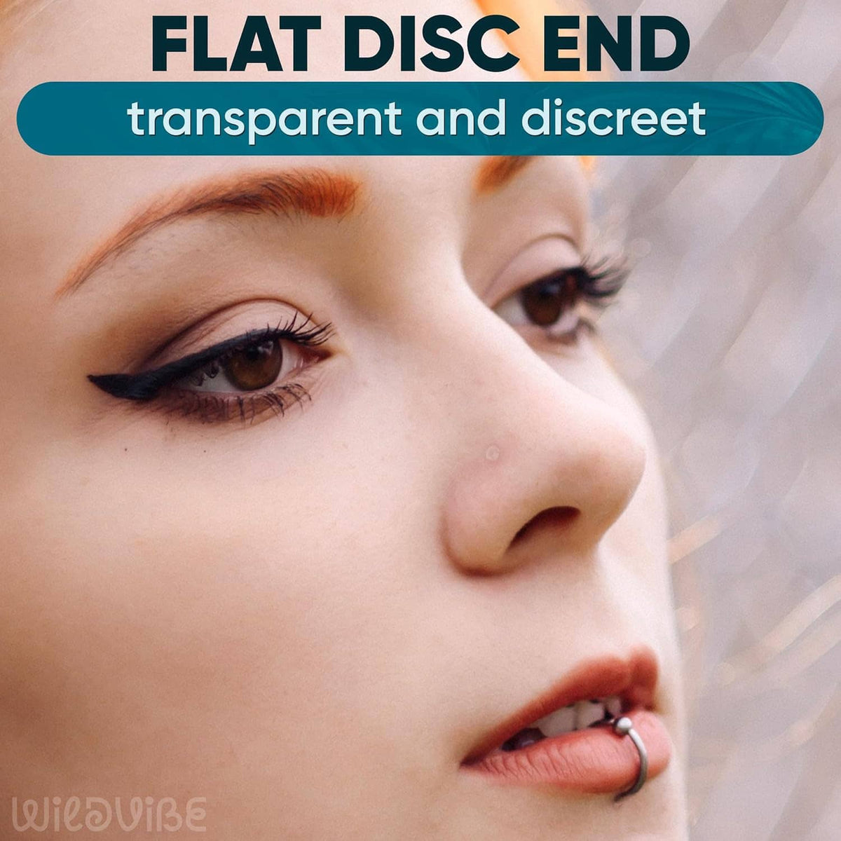 Close-up of a transparent L-shaped nose stud retainer at the nostril, flat disc end