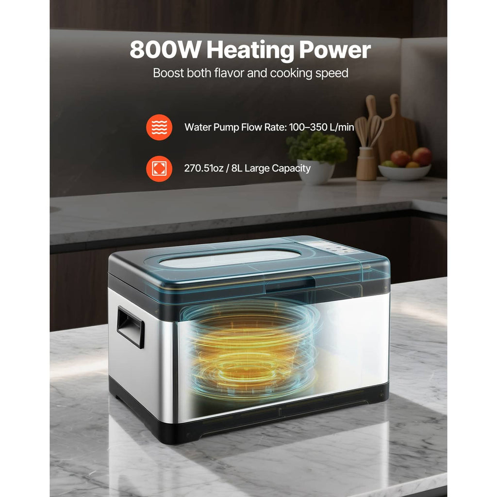 Sous vide cooker with visible heating chamber, black top and LCD display on stainless base