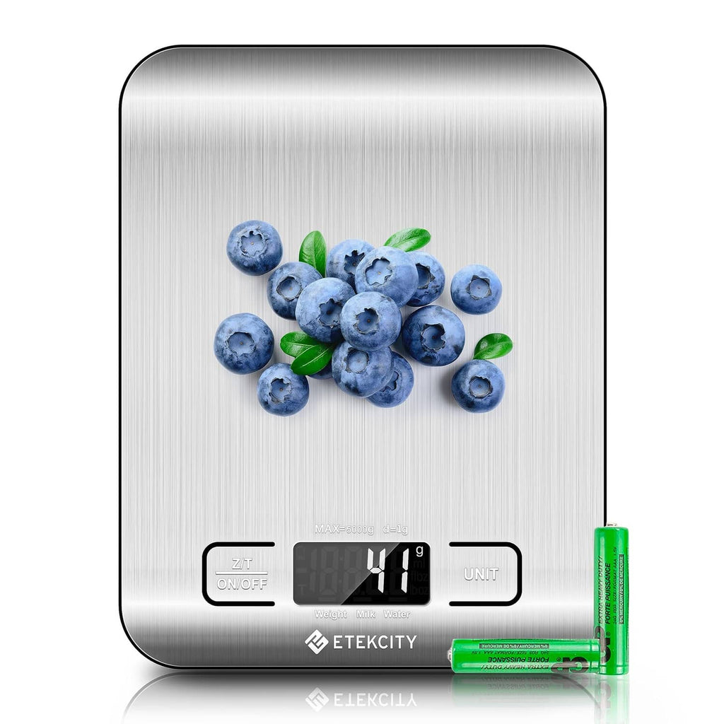 Digital kitchen scale with stainless platform, LCD readout, and blueberries on top