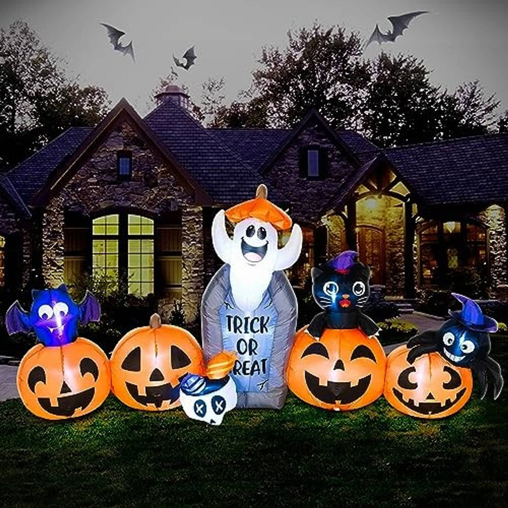 Halloween inflatable decoration set with ghost figure and black cat beside jack-o'-lantern pumpkins