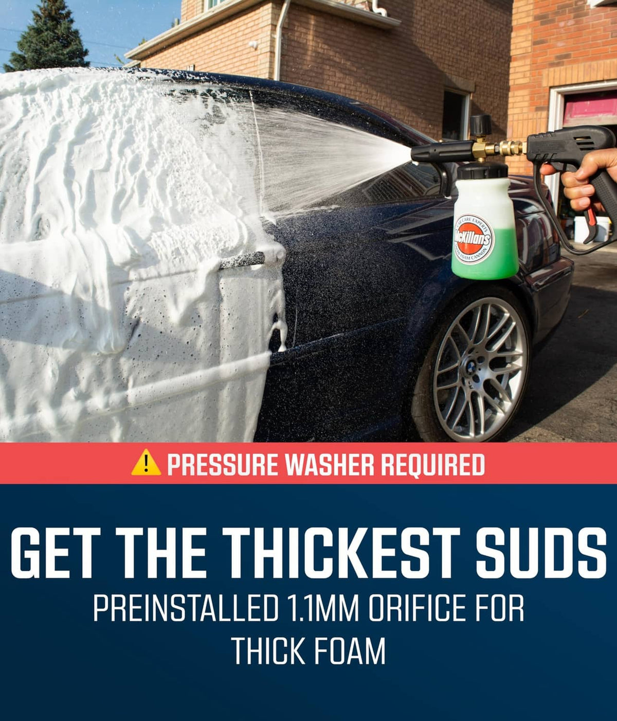 Foam cannon bottle and sprayer releasing thick white soap foam onto a vehicle