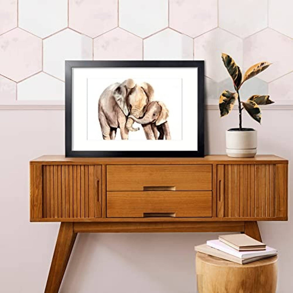 Black picture frame with mat, holding a photo of two elephants.