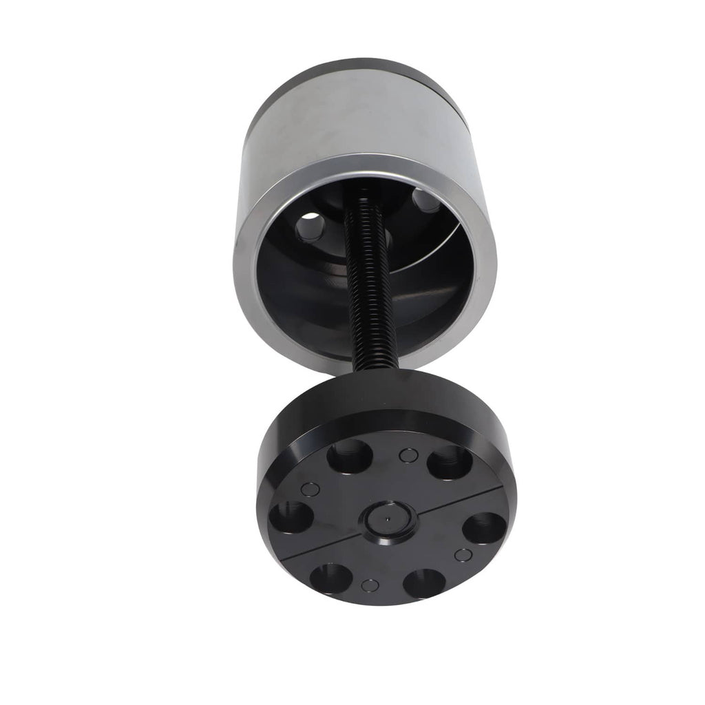 Bushing installation tool with threaded rod and black base plate with holes