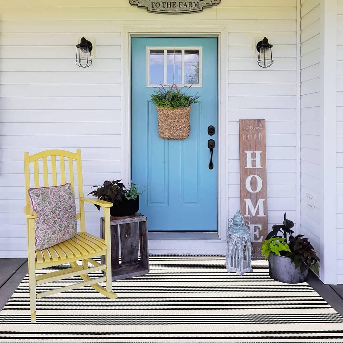 Rectangular black-and-white striped rug with evenly spaced horizontal stripes and flat weave.