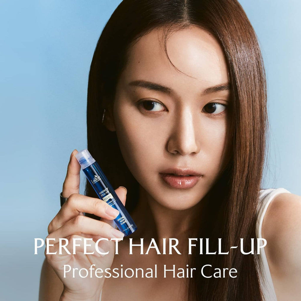 La'dor hair fill-up ampoule bottle held by a person, blue keratin formula