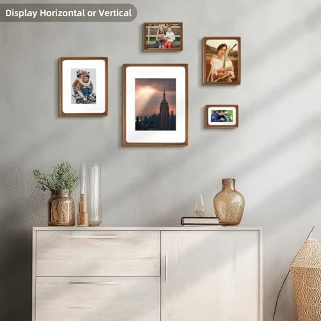 Brown solid wood picture frame with glass, mounted display on a wall