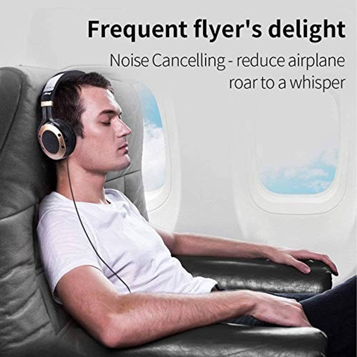 Noise cancelling over-ear headphones worn on an airplane seat, cushioned headband
