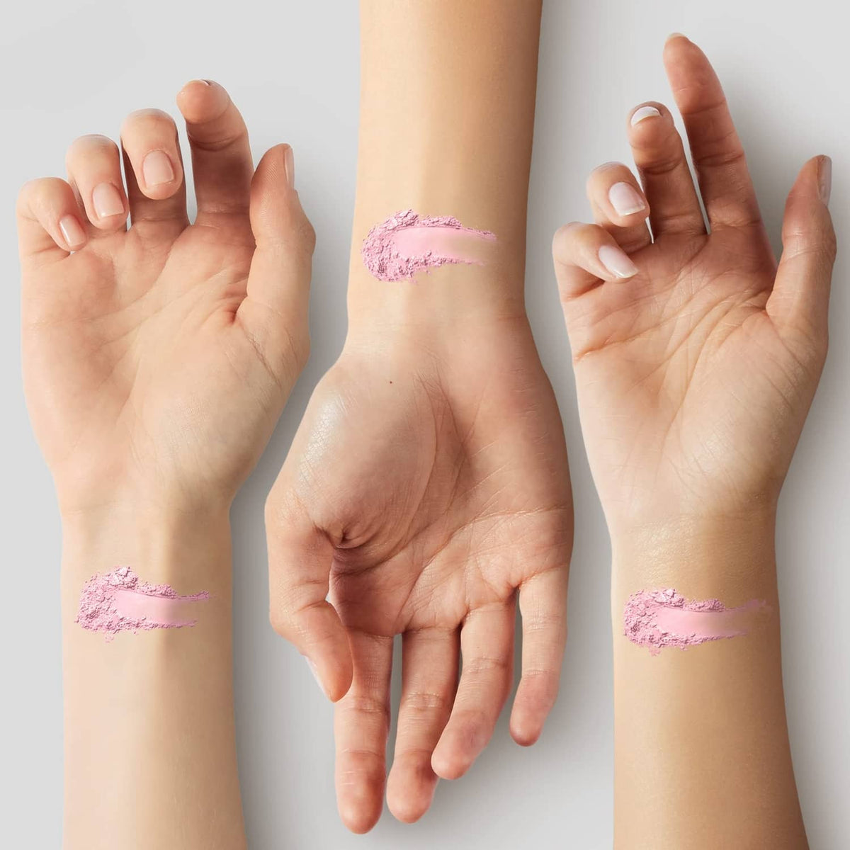 Porcelain powder swatches on hands, light beige makeup streaks