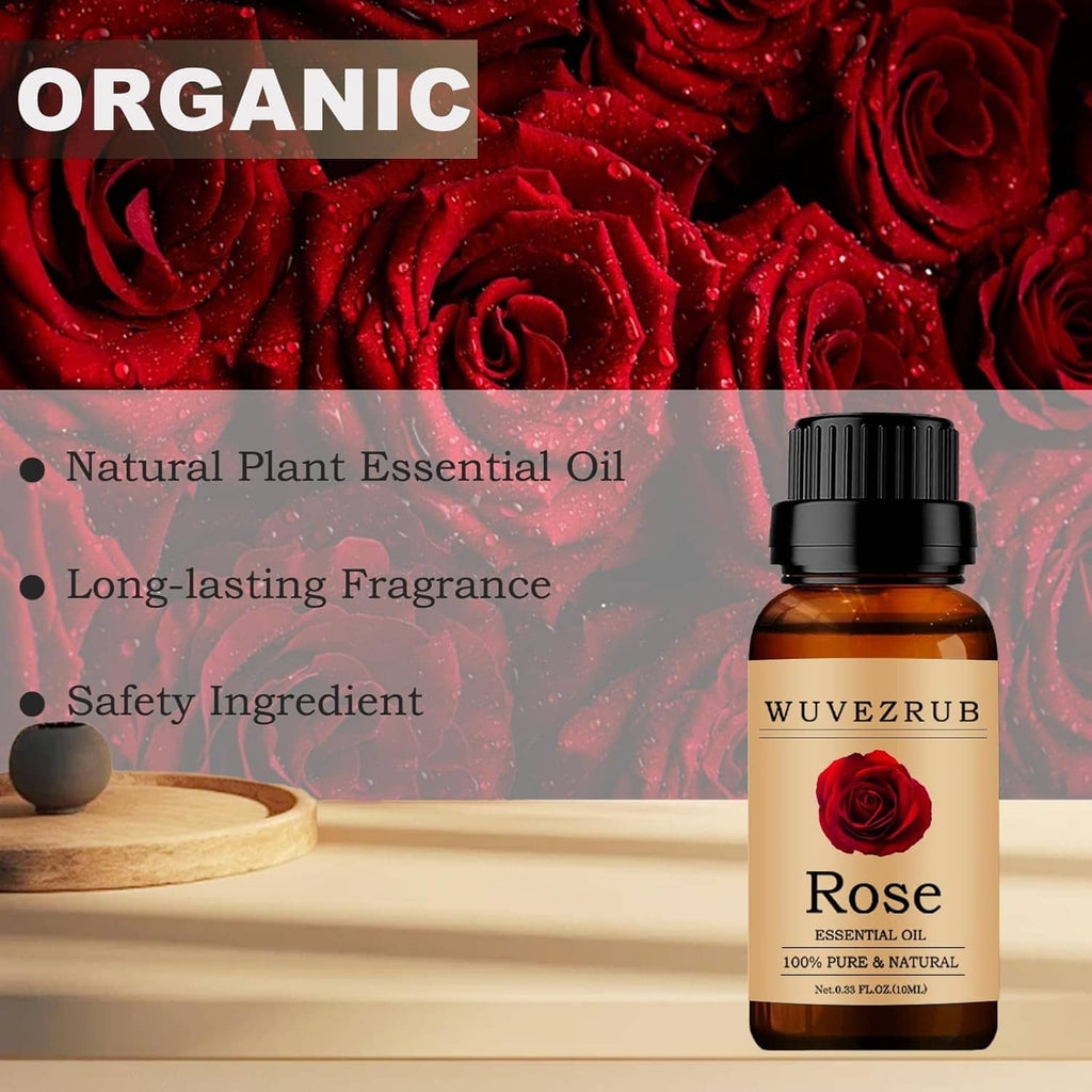 Rose essential oil bottle with black cap and amber glass, beside red roses.