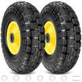 Pair of solid black tires with yellow rims and circular axle openings
