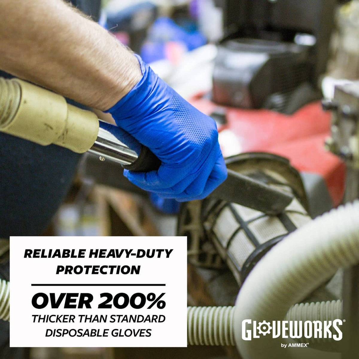 Royal blue nitrile glove protecting hand during tool work, heavy-duty