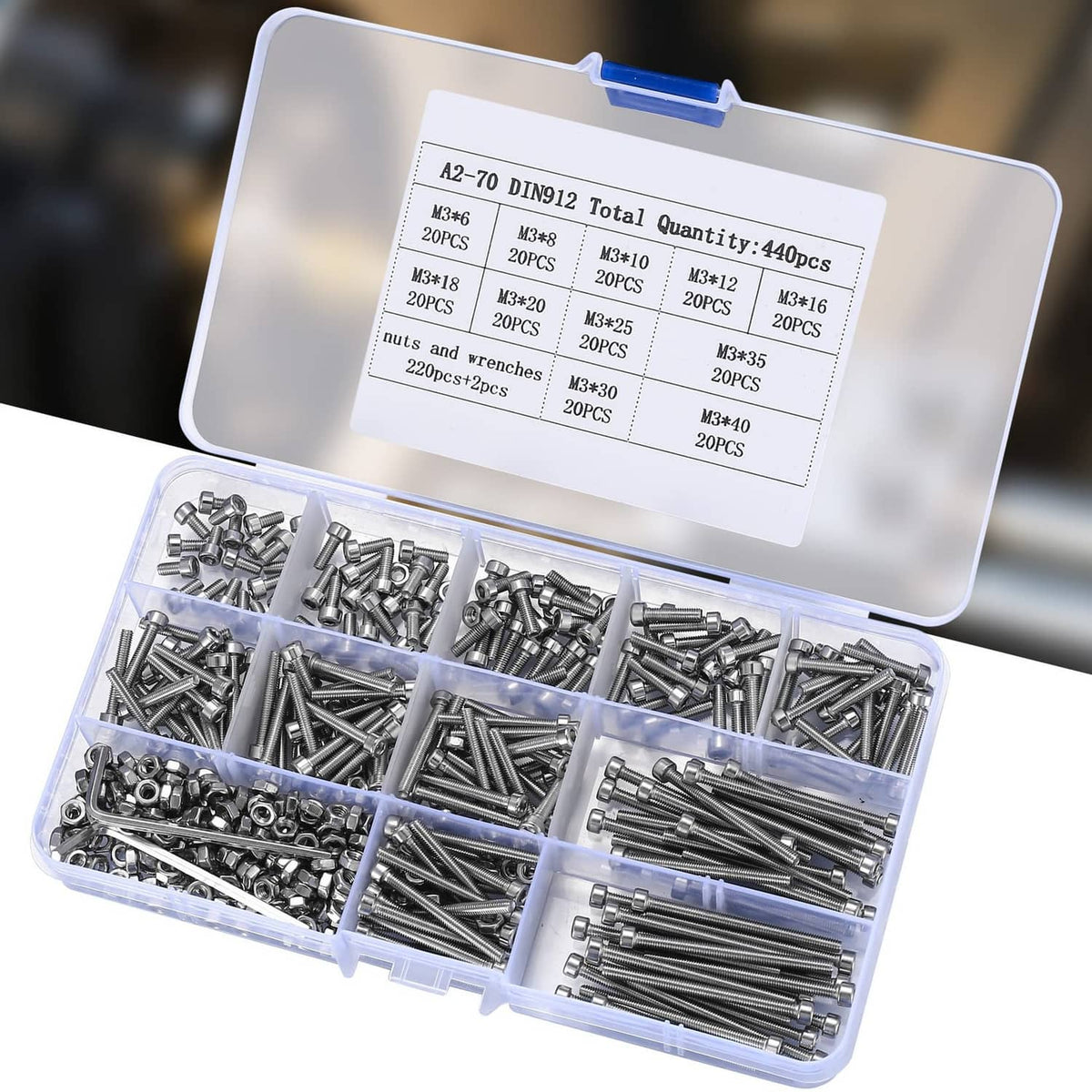 Open plastic organizer with compartments of silver M3 hex socket head screws and nuts