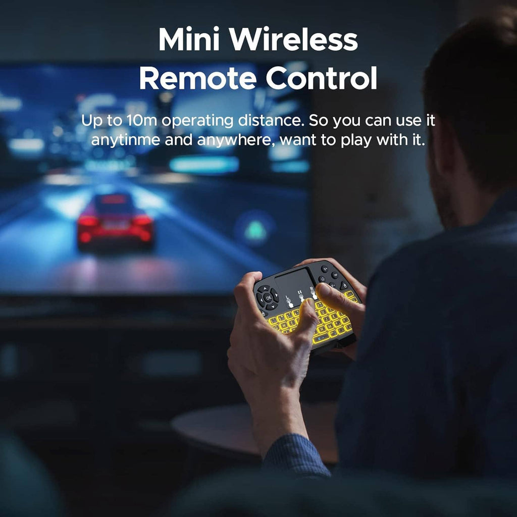 Hand holding a mini wireless remote-style keyboard with touchpad