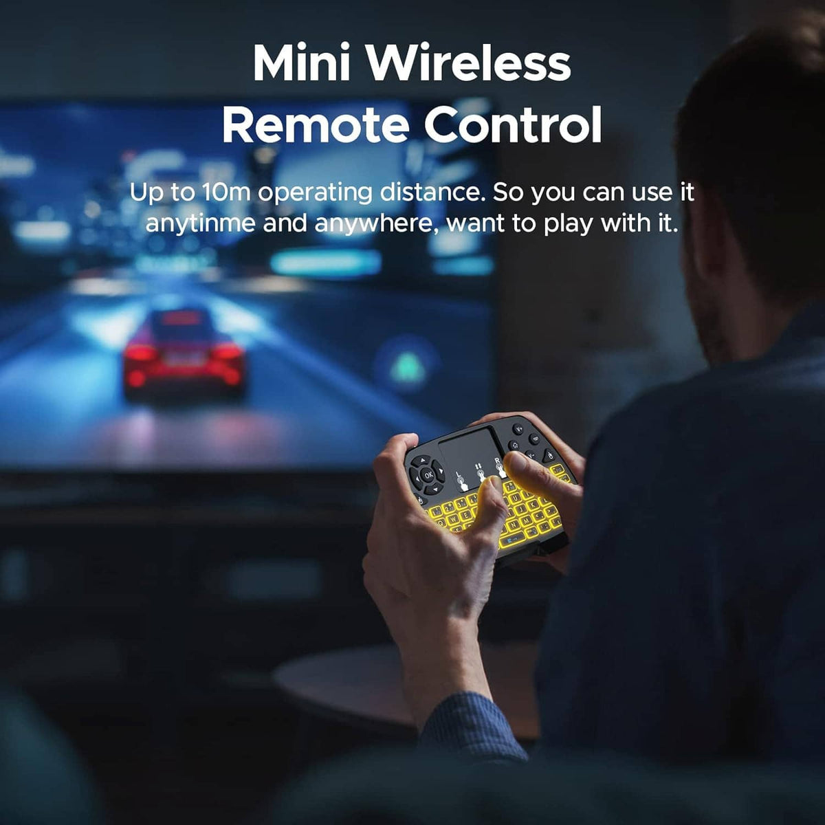 Hand holding a mini wireless remote-style keyboard with touchpad